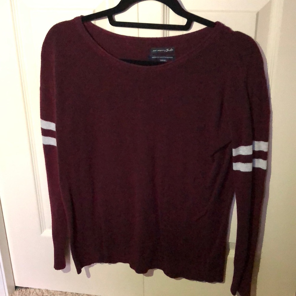 Long sleeve red shirt with white strips on arms